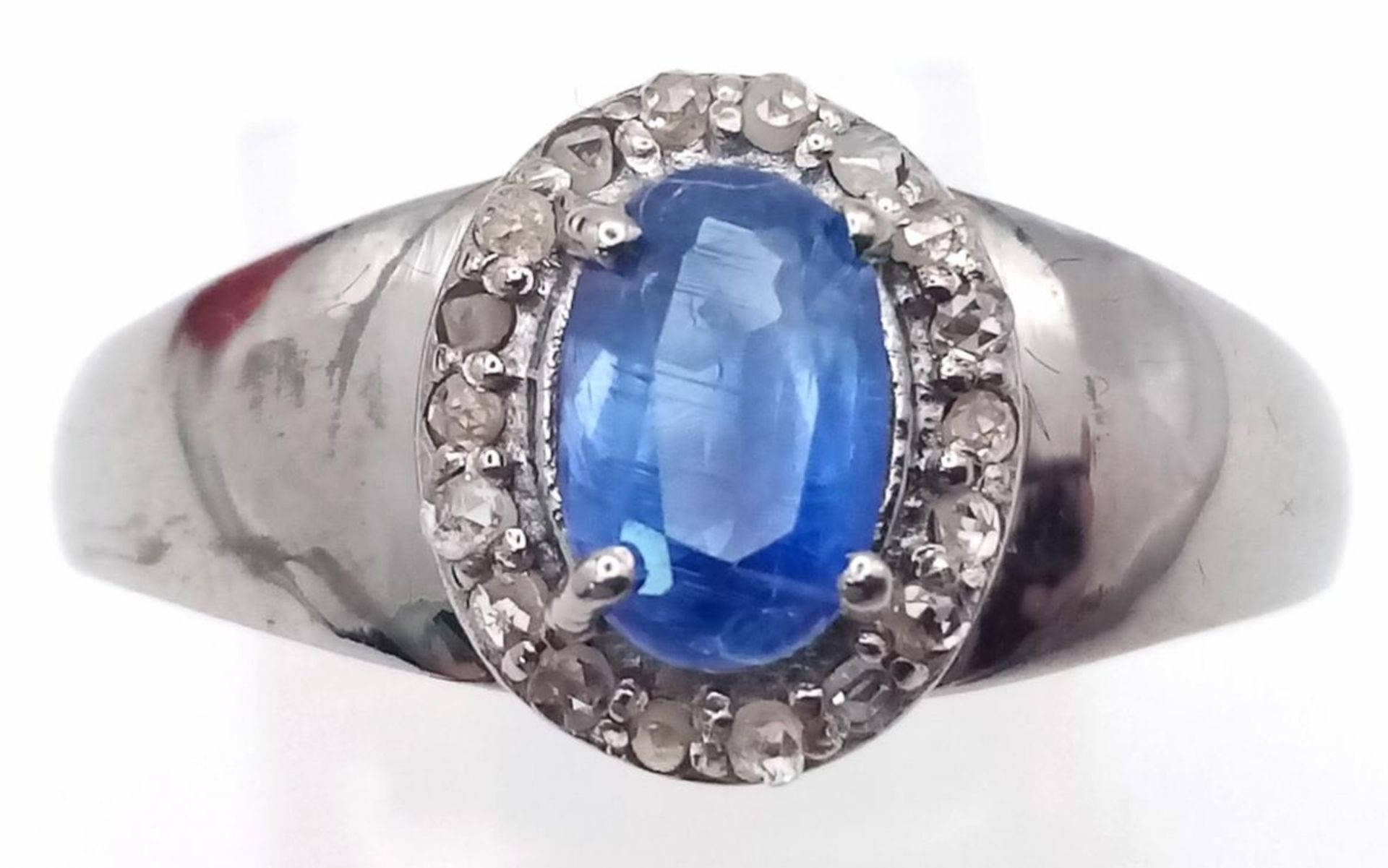 A Kyanite and Diamond Ring set in 925 Silver with a Black Rhodium Coating. Size O. Kyanite- 0.
