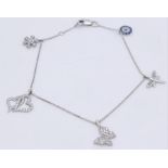 A 14kt White Gold Diamond Set Charm Bracelet. Variety of charms, this bracelet measures 16cm in