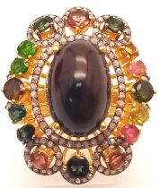 A 15ct Black Opal Ring with Multi-Coloured Tourmaline and Diamond Accents. Set in gilded 925 Silver.