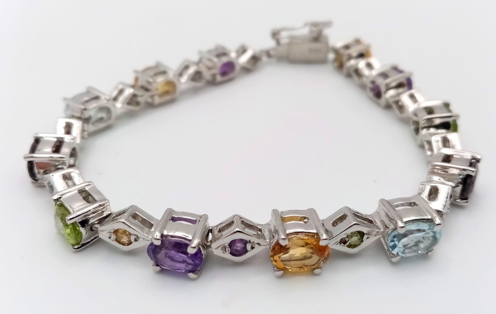 A Multi Gemstones 925 Silver Tennis Bracelet - Includes: Peridot, Citrine, Amethyst, Aquamarine - Image 2 of 4