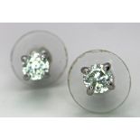 A Pair of White CZ Stone Stud Earrings.