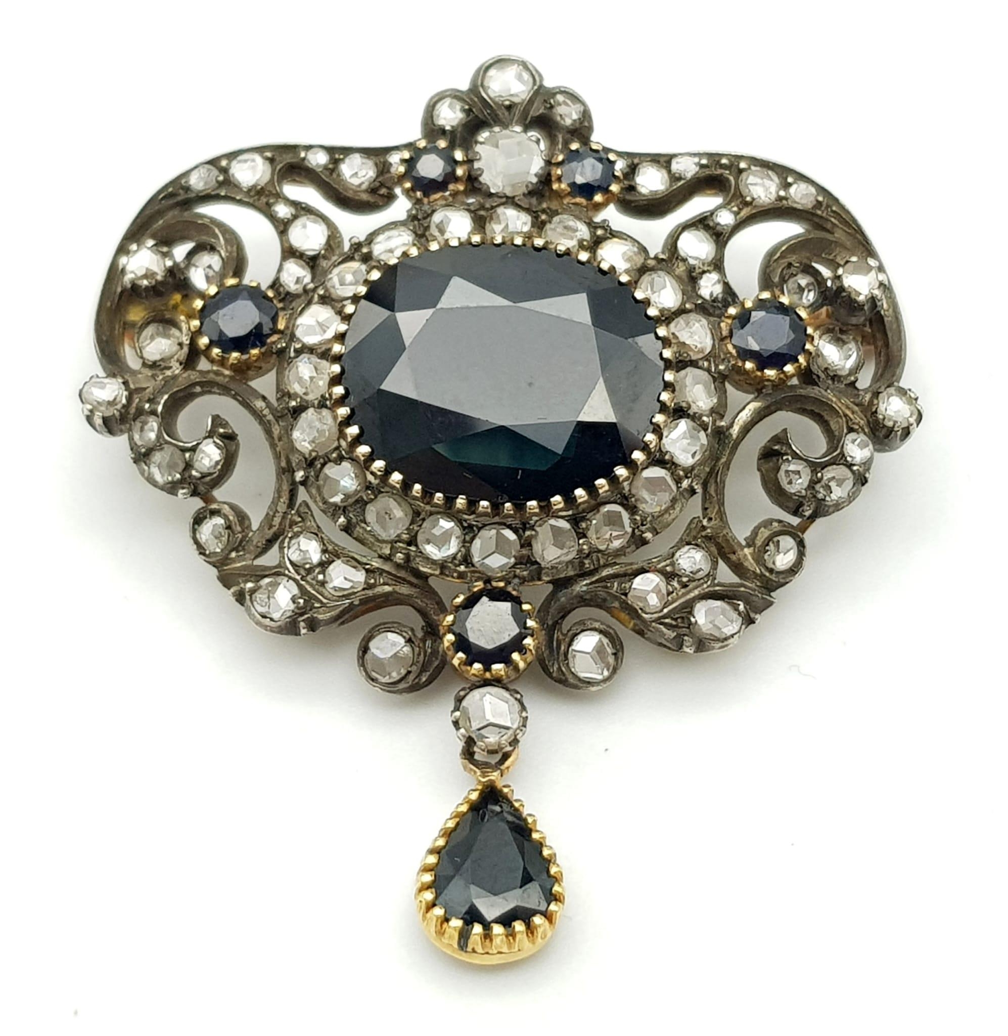 A VICTORIAN NECK BROOCH IN CLASSIC STYLE WITH DIAMONDS AND SAPPHIRES SET IN HIGH CARAT GOLD . 20.