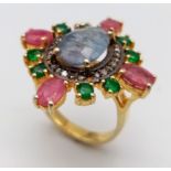 A Blue Sapphire, Ruby, Emerald and Diamond Ring set in Gold Plated 925 silver. Weight - 7.40g.