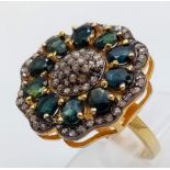 A Blue Sapphires & Diamond Decorative Floral Ring set in 925 Gold Plated Silver. Size N. Weight -