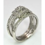 A 9K White Gold Diamond Three-Level Cluster Ring. Size I. 3.7g total weight.