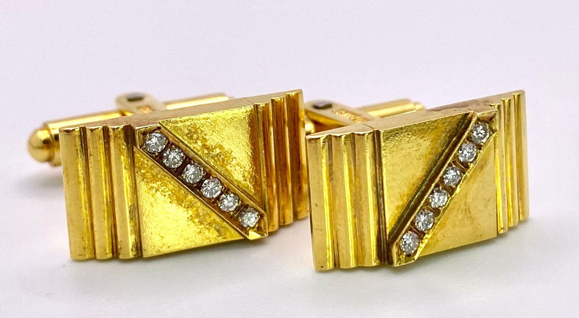 A Pair of 14K Yellow Gold and Diamond Cufflinks. Rich gold, rectangular cufflinks with a