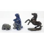 A trio of Animal Figurines. Featuring a stone Bear & standing one eyed Lizard, and a Brass Horse