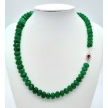 A 310ctw Emerald Necklace with Ruby and Diamond Clasp, set in 925 Silver. 42cm length. 63g total