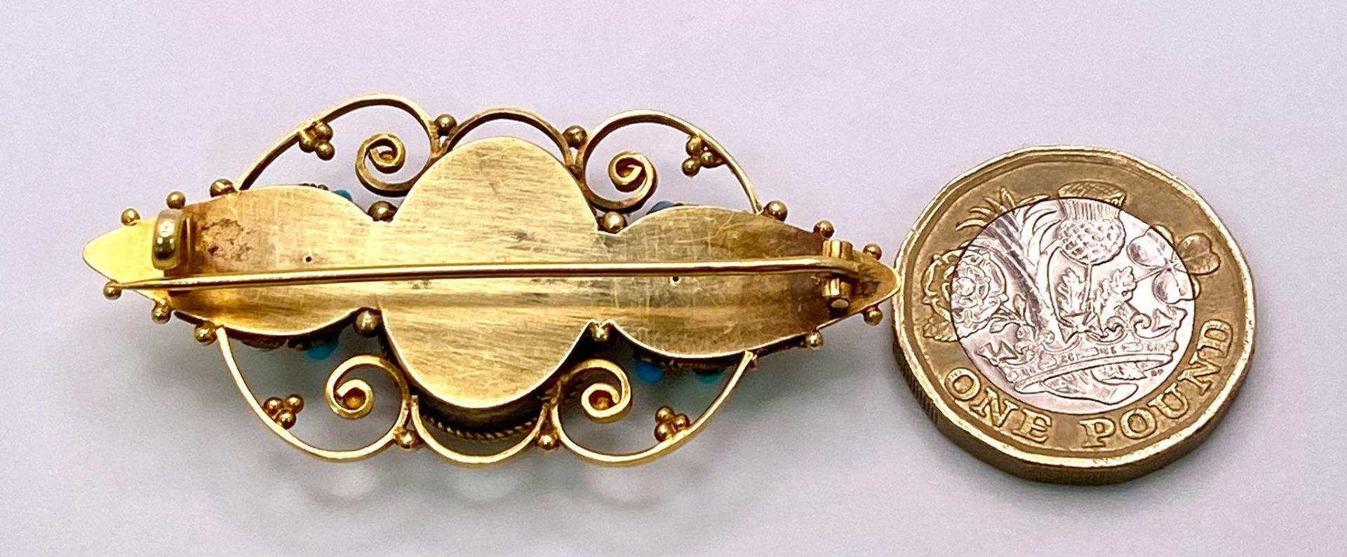 An Antique, Victorian 15K Gold and Turquoise Brooch. Scrolled and mirrored decoration. 5.5cm. 8. - Image 3 of 3