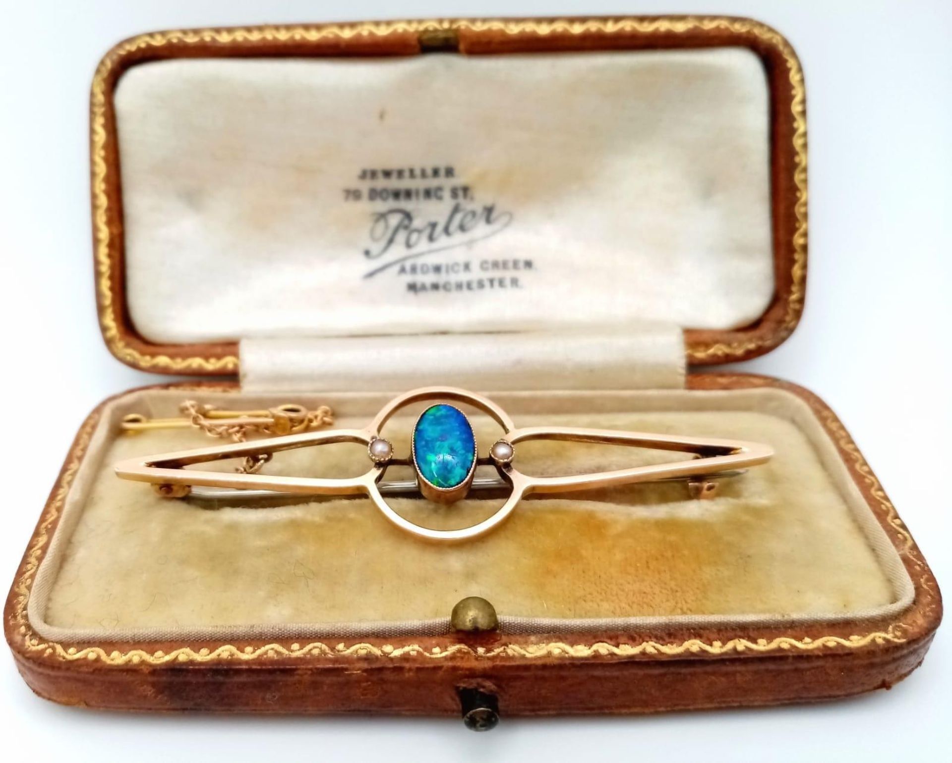 An Antique Australian Black Opal Bar Brooch. 6cm. Pin has been replaced. Fitted box. 3.8g