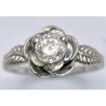 Sterling Silver Ring with Pink Stone set within floral setting. Size: N Weight: 3.21g