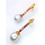 A Pair of 9K Yellow Gold South Sea Pearl and Multi-Coloured Sapphire Drop Earrings. Comes with a