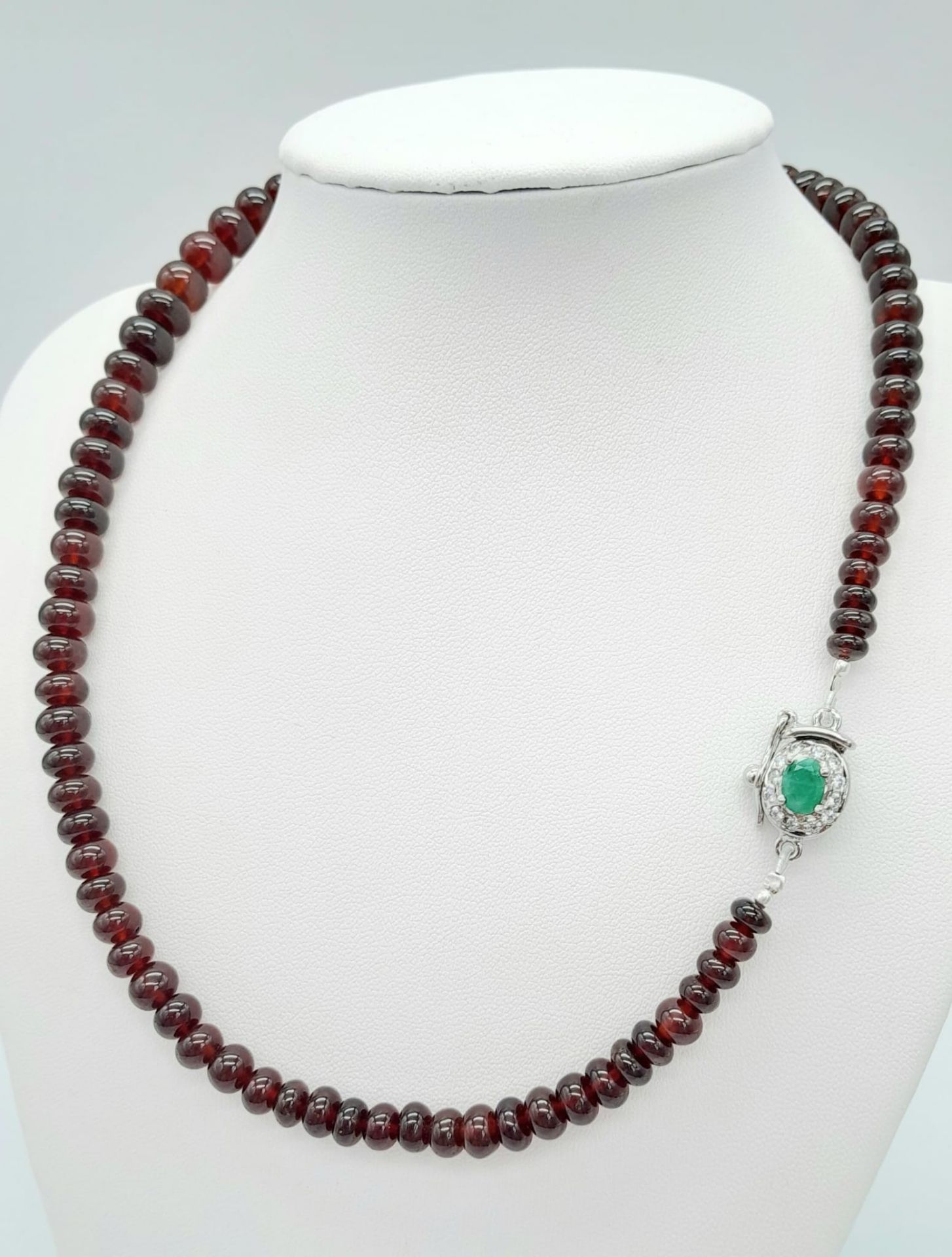 A 260ctw Garnet Rondelle Gemstone Necklace with Emerald Clasp - Set in 925 Silver. 44cm length. 53.