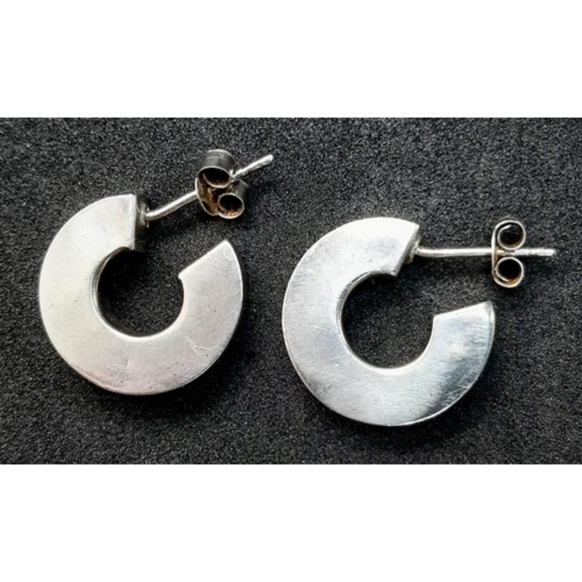 Pair of Sterling Silver 'C' design earrings. Weight: 4.36g