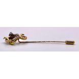 An Antique Mid-Carat Gold Hat Pin with cute little creature accent. Measuring 9cm in length and