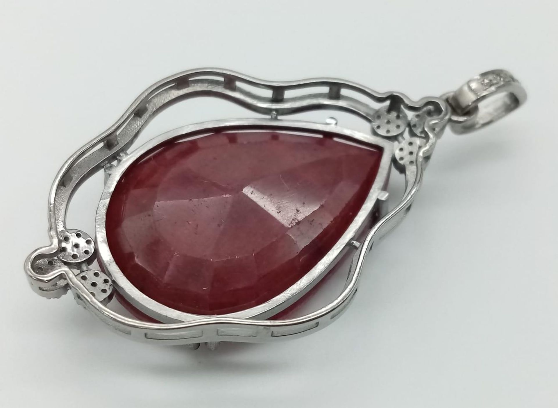 A 55.95ct Ruby Teardrop Pendant with 0.45ctw of Diamond Accents. 17.5g total weight. 5.5cm. Comes - Image 3 of 5