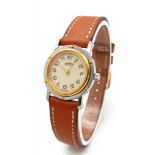 A FABULOUS HERMES OF PARIS LADIES WRISTWATCH WITH GOLD AND STAINLESS STEEL BODY AND TASTEFUL CREAM