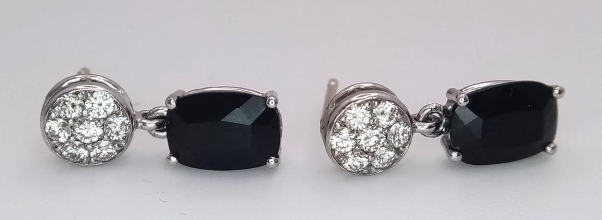 A Pair of 18K Diamond and Onyx Earrings. Diamond clusters and rectangular cut onyx. No backs. With - Image 2 of 4