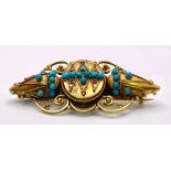 An Antique, Victorian 15K Gold and Turquoise Brooch. Scrolled and mirrored decoration. 5.5cm. 8.