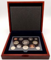 A Royal Mint 2007 Executive Proof Coin Set. 12 coins in total. Comes in a wood presentation case.