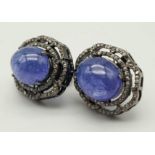 A Pair of Pale Blue Tanzanite Cabochon Gemstone Earrings with Diamond Surrounds set in 925 Silver.