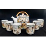 A Chinese Tea Set with 6 cups. Comprising of a Teapot with bamboo handle and six Chinese Tea Cups.