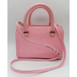 A Victoria Beckham two toned candy pink textured leather mini bag, patent leather trim with gold