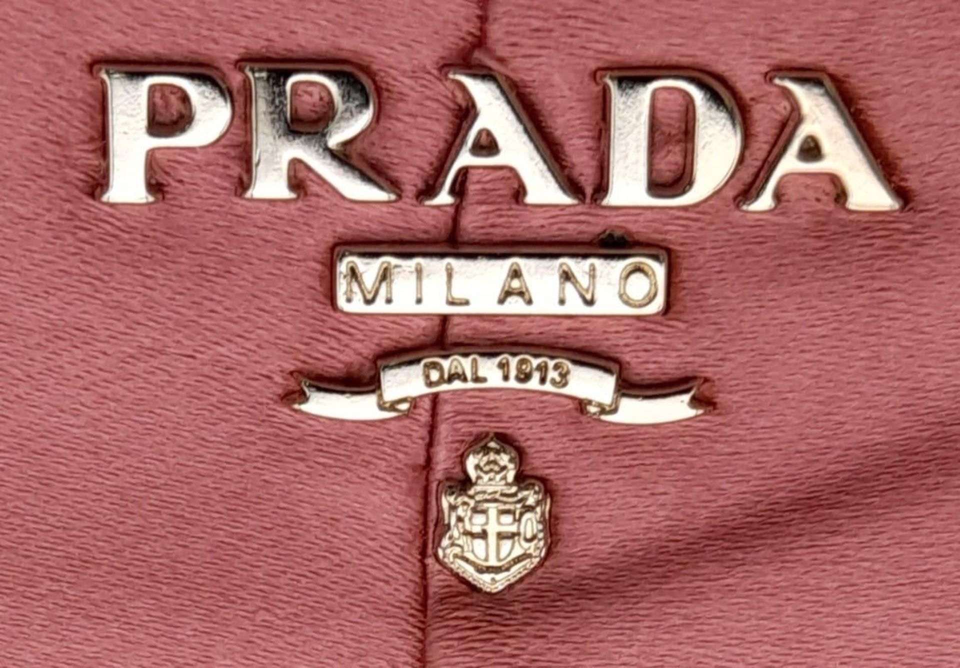 A Prada Pink Pleated Clutch Bag. Satin exterior with silver-toned hardware and press lock closure to - Bild 8 aus 9