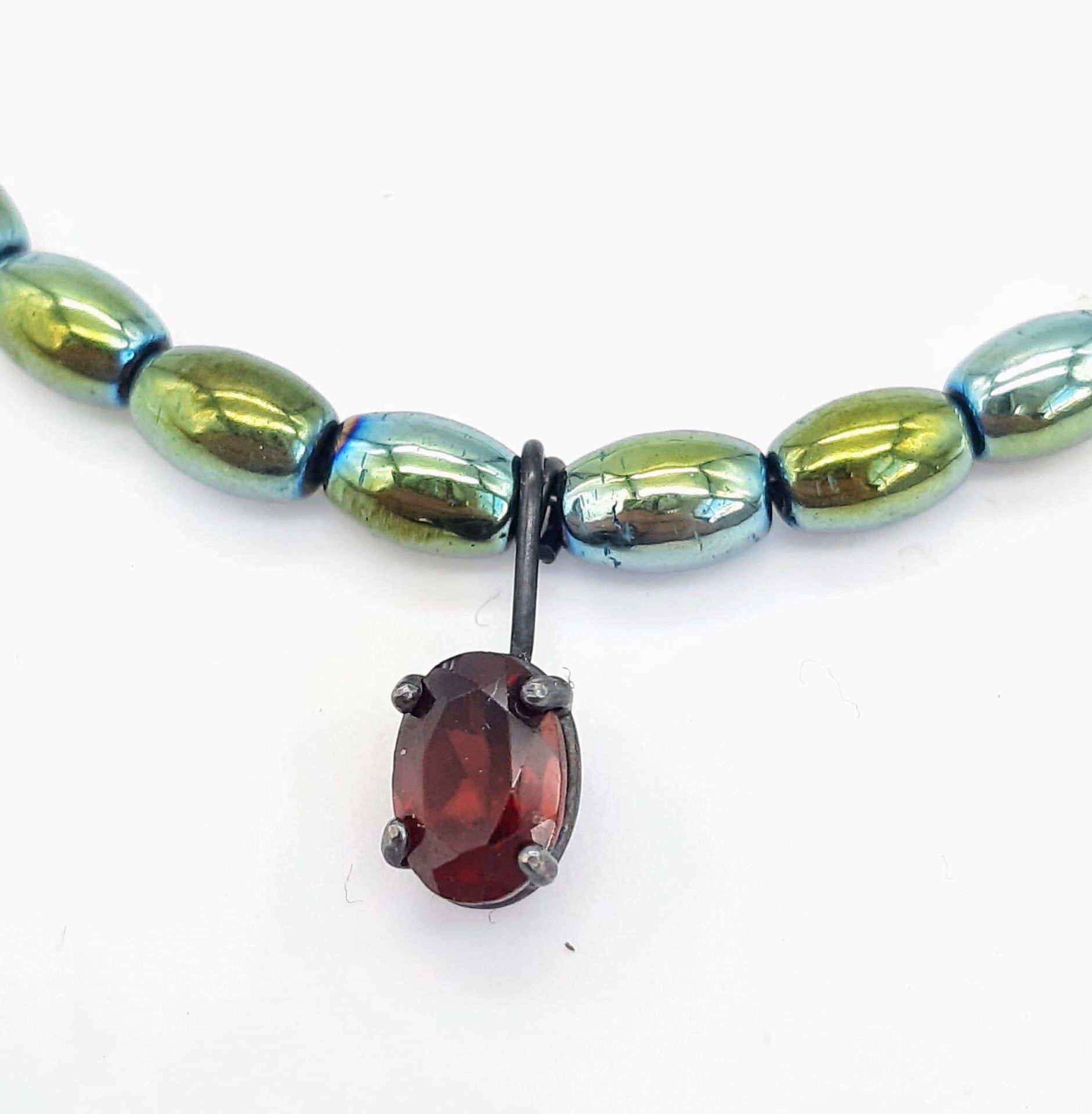 A Green Metallic Hematite Necklace with Red Stone Pendant and Silver Clasp. 36cm - Image 3 of 3