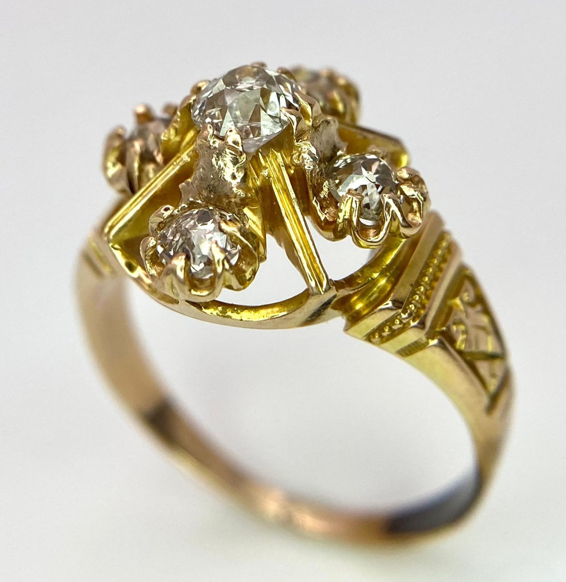 A 9K Yellow Gold (tested) Diamond Ring. Five round cut diamonds on a raised setting. Size N. 4.32g