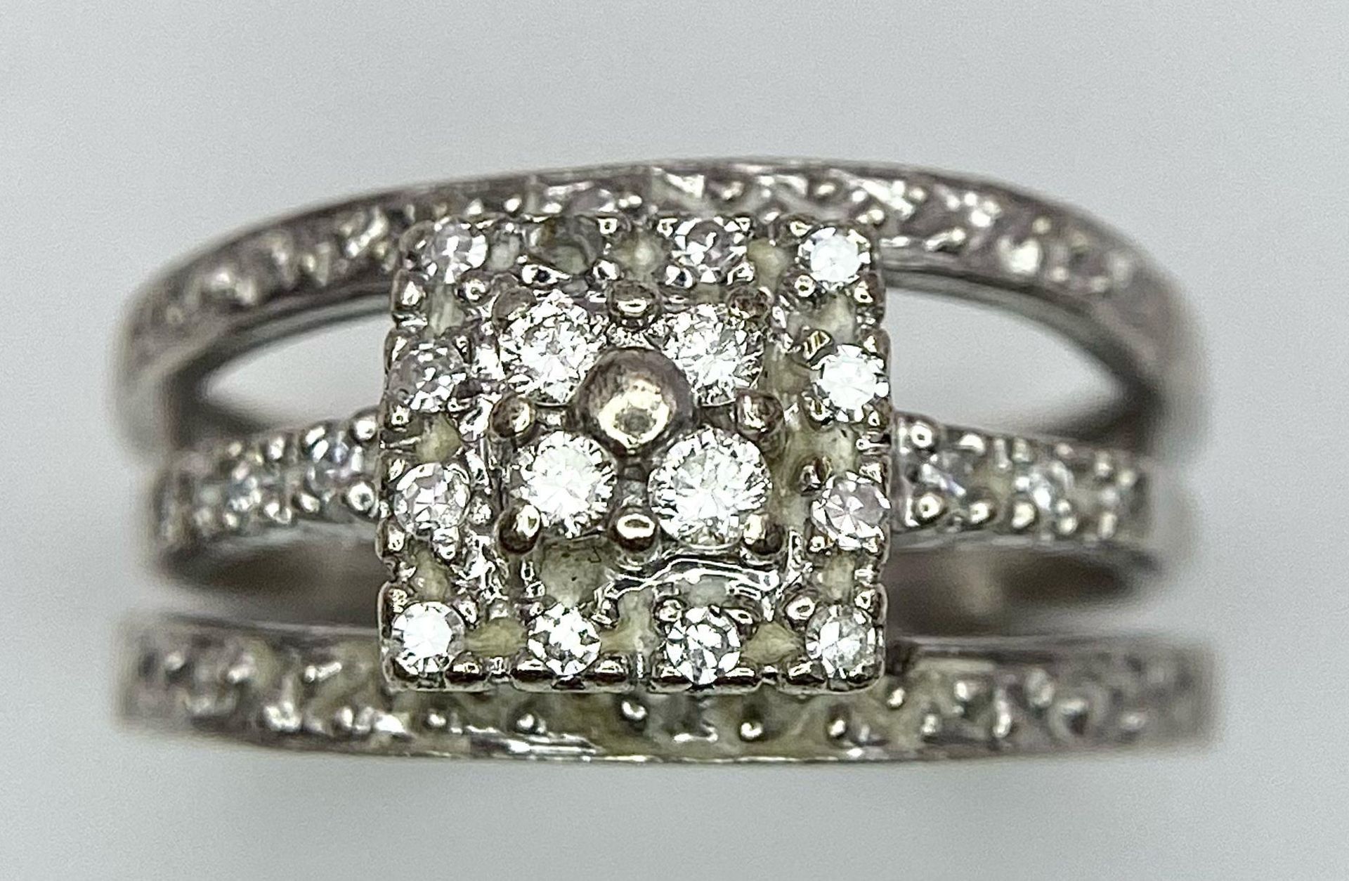 A 9K White Gold Diamond Three-Level Cluster Ring. Size I. 3.7g total weight. - Image 2 of 5