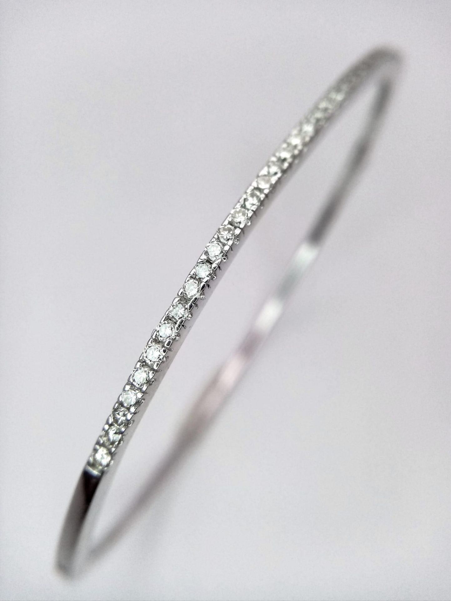 Superb 18kt White Gold, Diamond Set Bangle. With a safety, hinge release this beautiful bangle