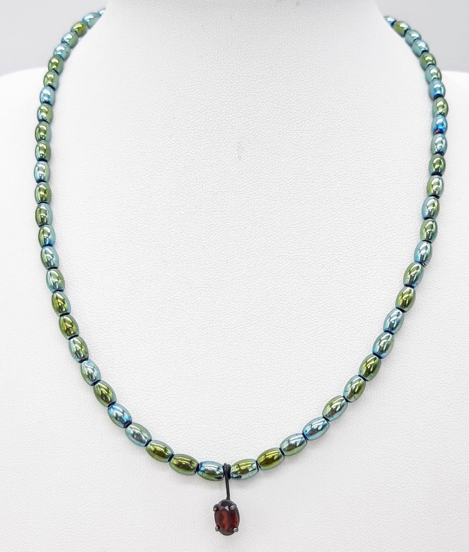 A Green Metallic Hematite Necklace with Red Stone Pendant and Silver Clasp. 36cm