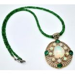 A Fancy Opal, Diamond and Emerald Pendant with a Detachable Green Garnet Necklace. Centre opal