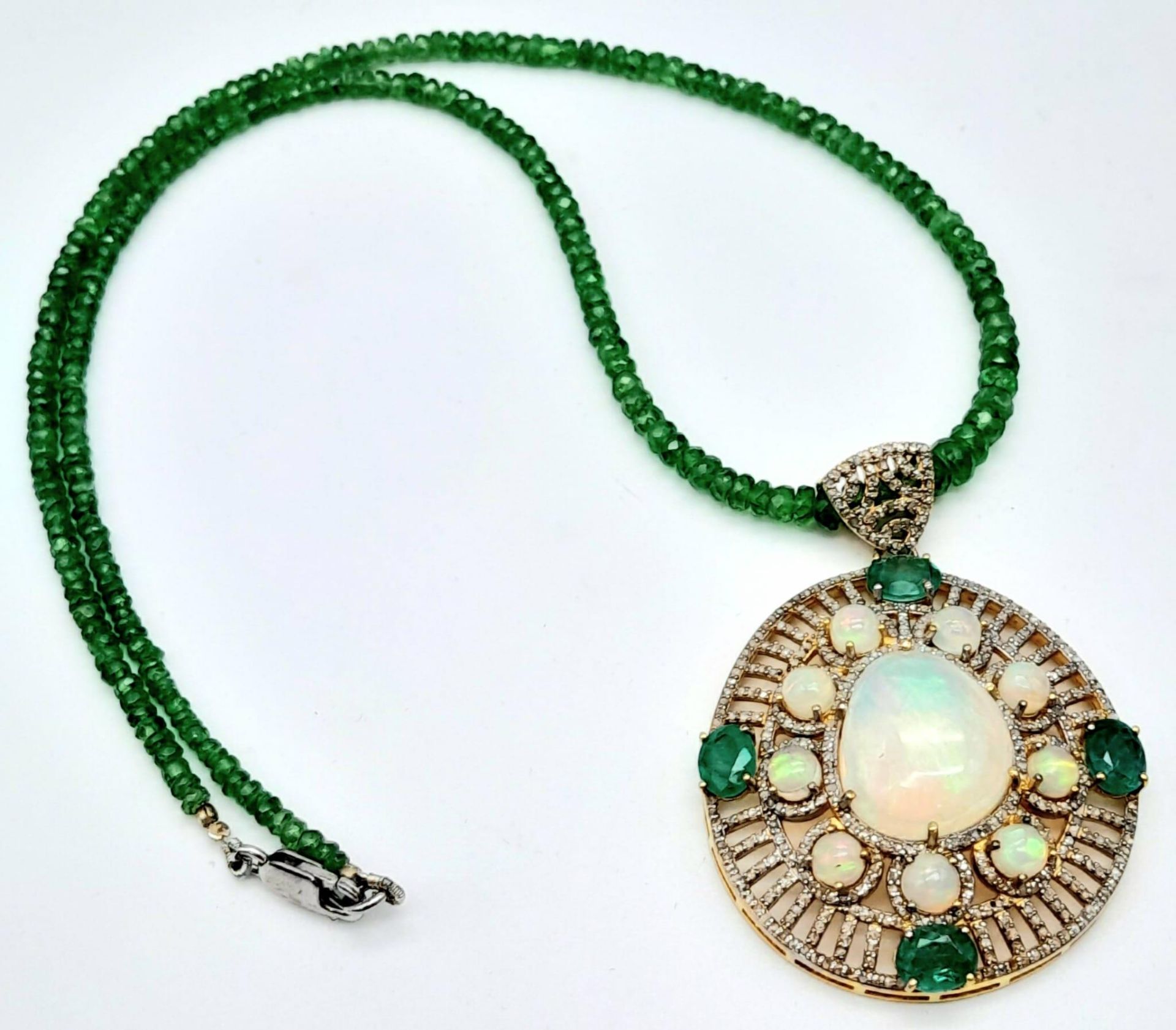 A Fancy Opal, Diamond and Emerald Pendant with a Detachable Green Garnet Necklace. Centre opal