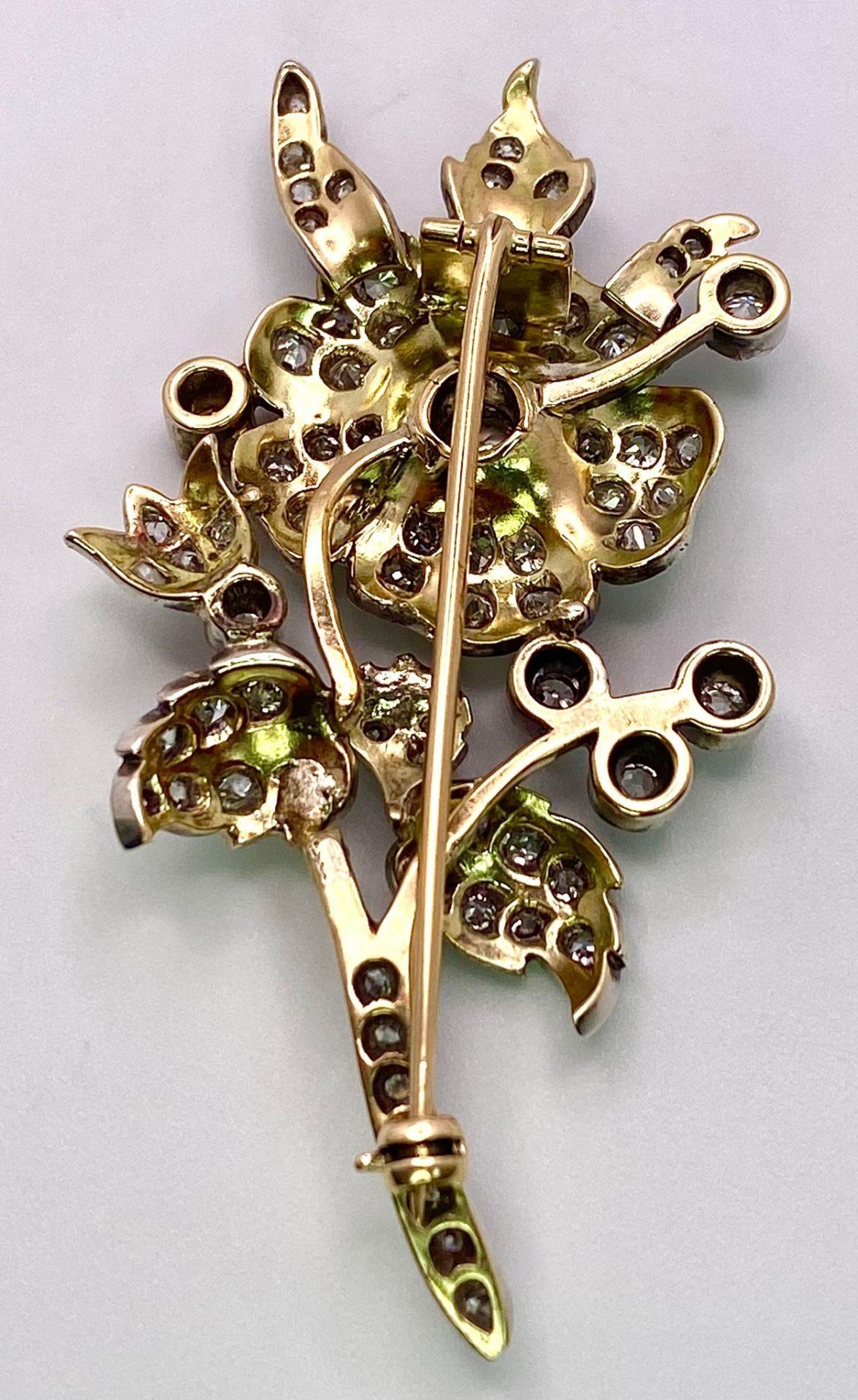 An Antique 18K Gold and Diamond Floral Brooch. This beautifully constructed masterpiece has a - Image 7 of 7