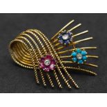 A 18kt Yellow Gold Woven Design Floral Brooch. Features three diamond centred flowers, which consist