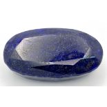 A 605ct Blue Sapphire - Oval cut and heat treated. 7cm x 4cm. No certificate so as found.