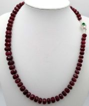 A 280ctw Faceted Ruby Rondelle Necklace with Emerald and Diamond 925 Silver clasp. 44cm length.