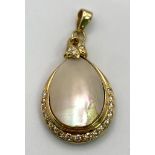 An 18K Yellow Gold, Diamond and Mother of Pearl Pendant. Teardrop Mother of Pearl cabochon with