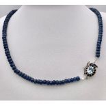 A 170ctw Faceted Blue Sapphire Rondelle Necklace with Blue Topaz Clasp - Set in 925 Silver. 44cm.