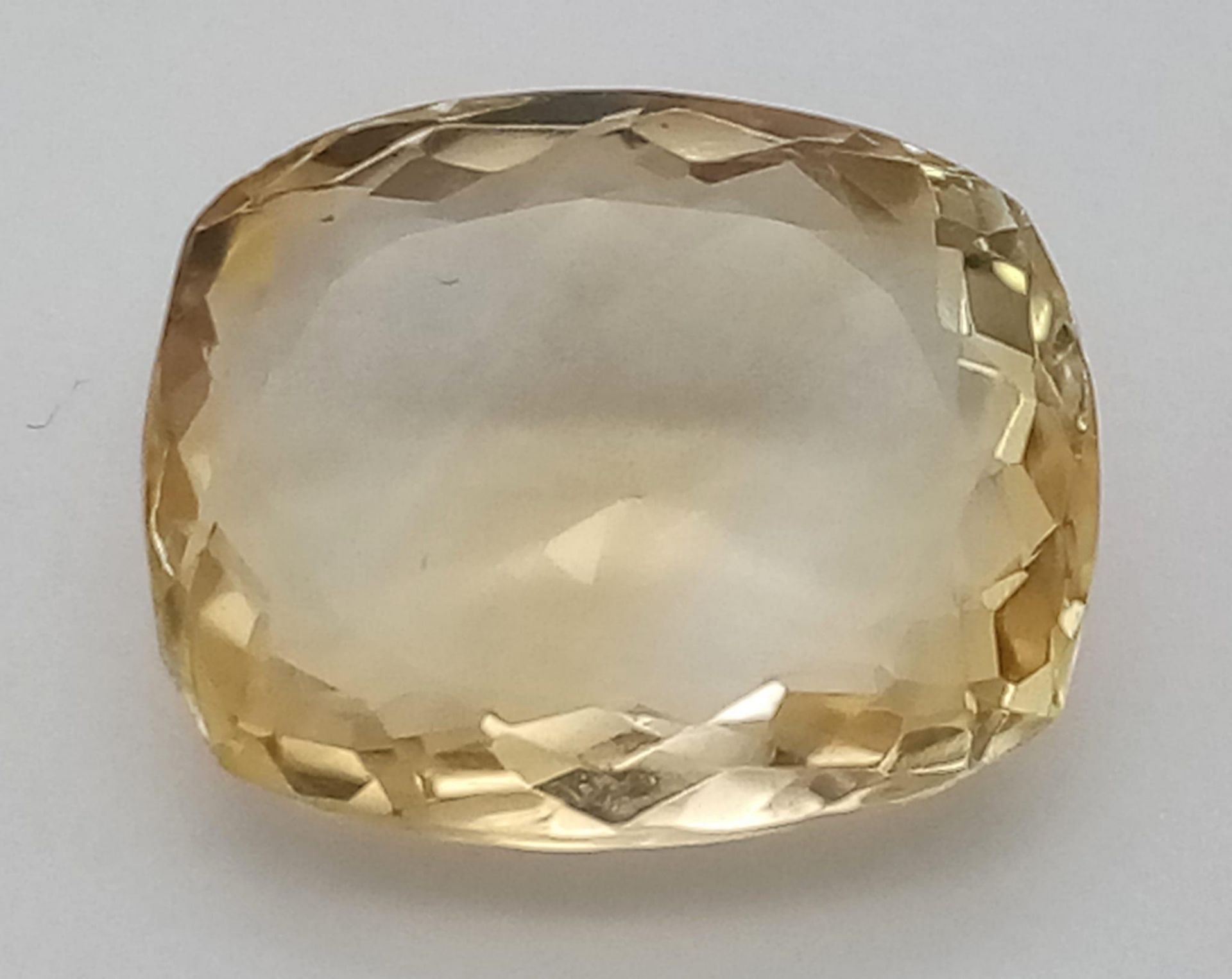 An 8.30ct Faceted Cushion Cut Brazilian Citrine. Comes with GLI certificate. Ref: CV10