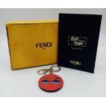 A red leather Fendi monster keychain, silver tone hardware. Diameter6cm. Comes with box. ref:16444