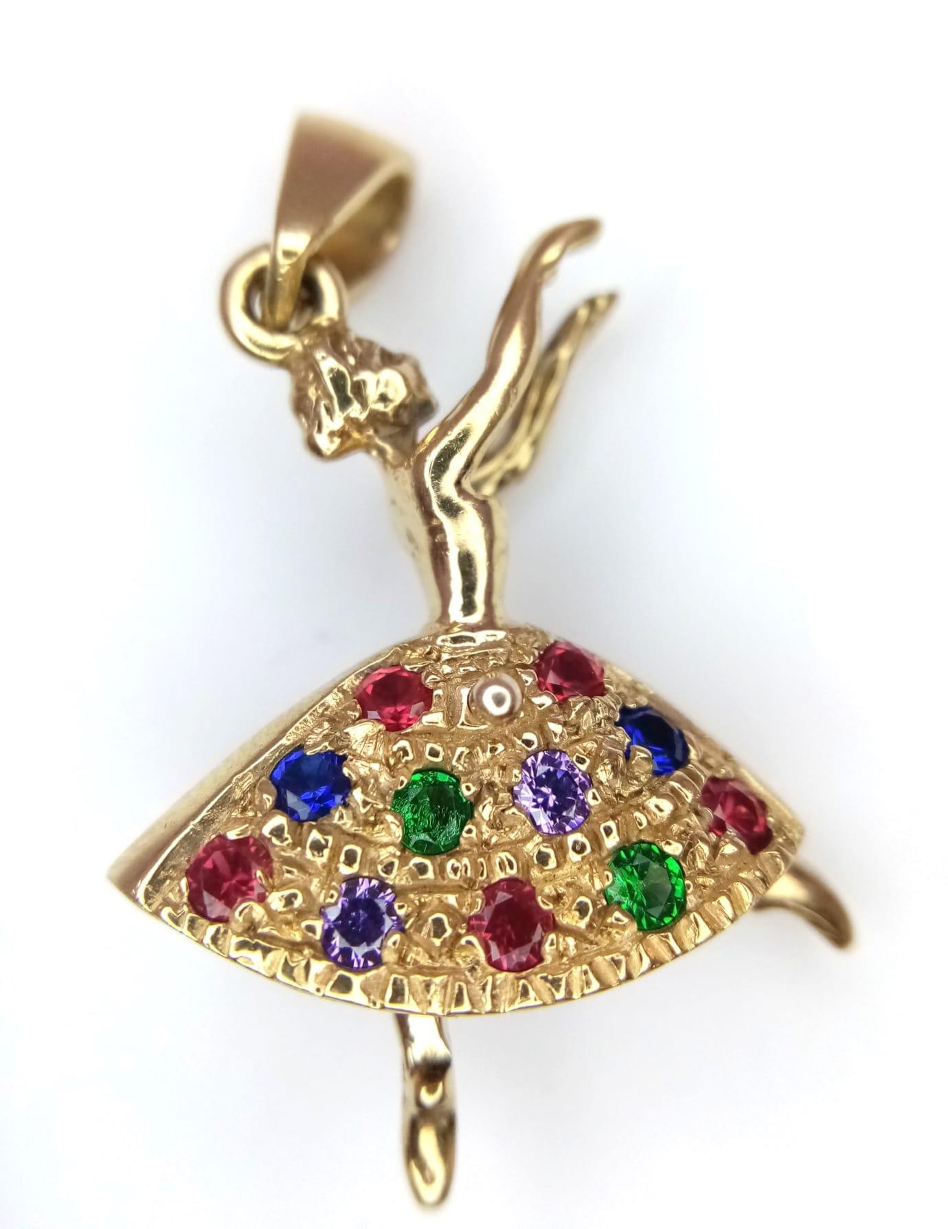 A 9kt Yellow Gold Jewelled Dancing Ballerina Charm/Pendant. Measures 3cm in length. Weight: 5.06g