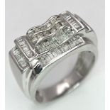 A FABULOUS 9K WHITE GOLD GENTS RING WITH 1CT OF DIAMONDS TO ENHANCE THIS HANDSOME PIECE OF JEWELLERY