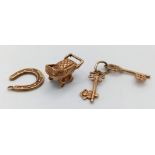 Three 9K Gold Pendants/ Charms - Pram, keys and lucky horseshoe! 2.76g total weight.