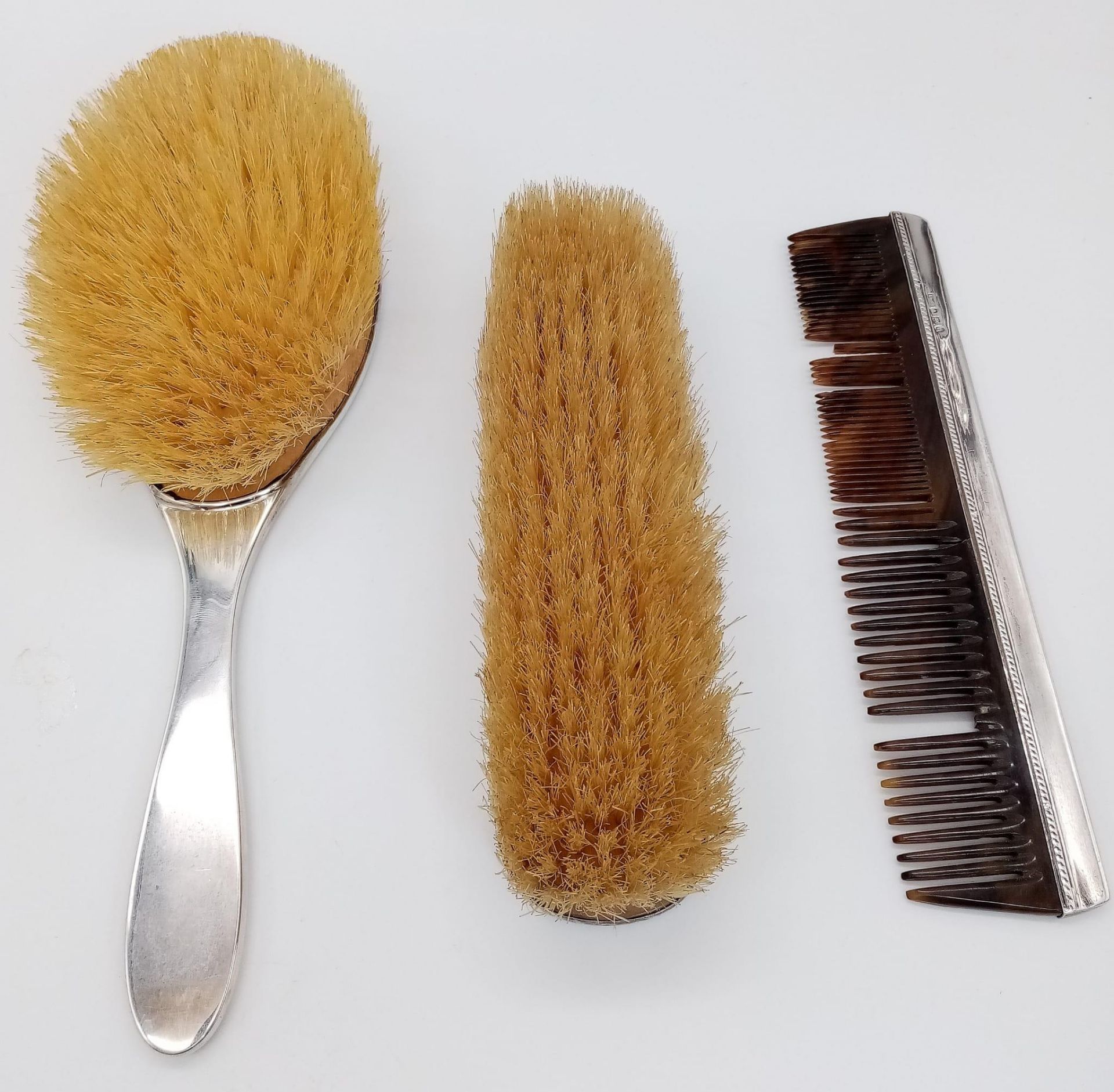 An Antique Sterling Silver Hair, Clothes Brush and Comb Set. Hallmarks for Birmingham 1919. Makers - Image 3 of 12