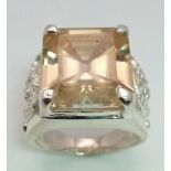 A Heavenly 19.60ct Champagne Moissanite Ring set in 925 Silver. Rectangular-cut gemstone. Comes with