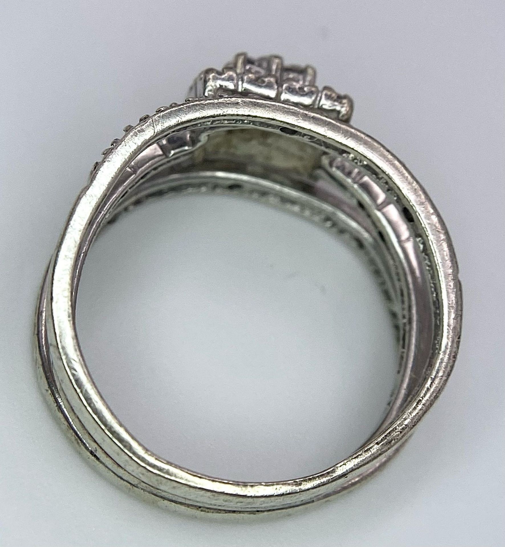 A 9K White Gold Diamond Three-Level Cluster Ring. Size I. 3.7g total weight. - Image 3 of 5