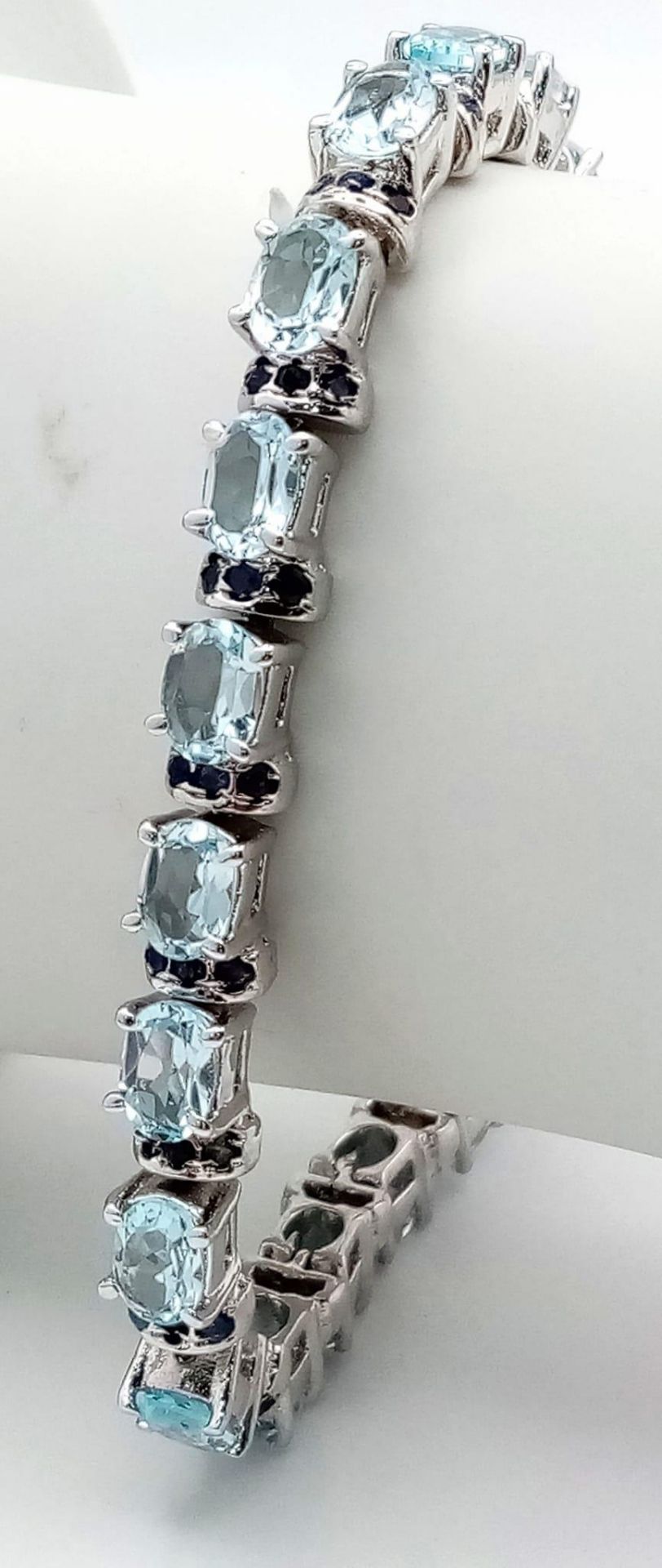 An Aquamarine Gemstone Tennis Bracelet set in 925 Silver. 18cm length. 28g. Ref: HV -2177 - Image 2 of 3